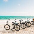 A Row of rental e-bikes on Kailua Beach near Kailua Bay