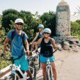 A Group riding electric bikes by the Lanikai Monument on their way into Kailua Town near Kailua Beach