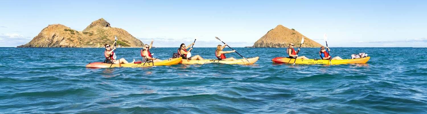 Kayakers paddling in front of the mokulua islands for a kayak tour