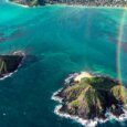 A fantastic photo of kailua's Mokulua islands with a rainbow over it