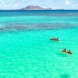 Kailua's Clear Ocean waters with kayakers paddling in the ocean